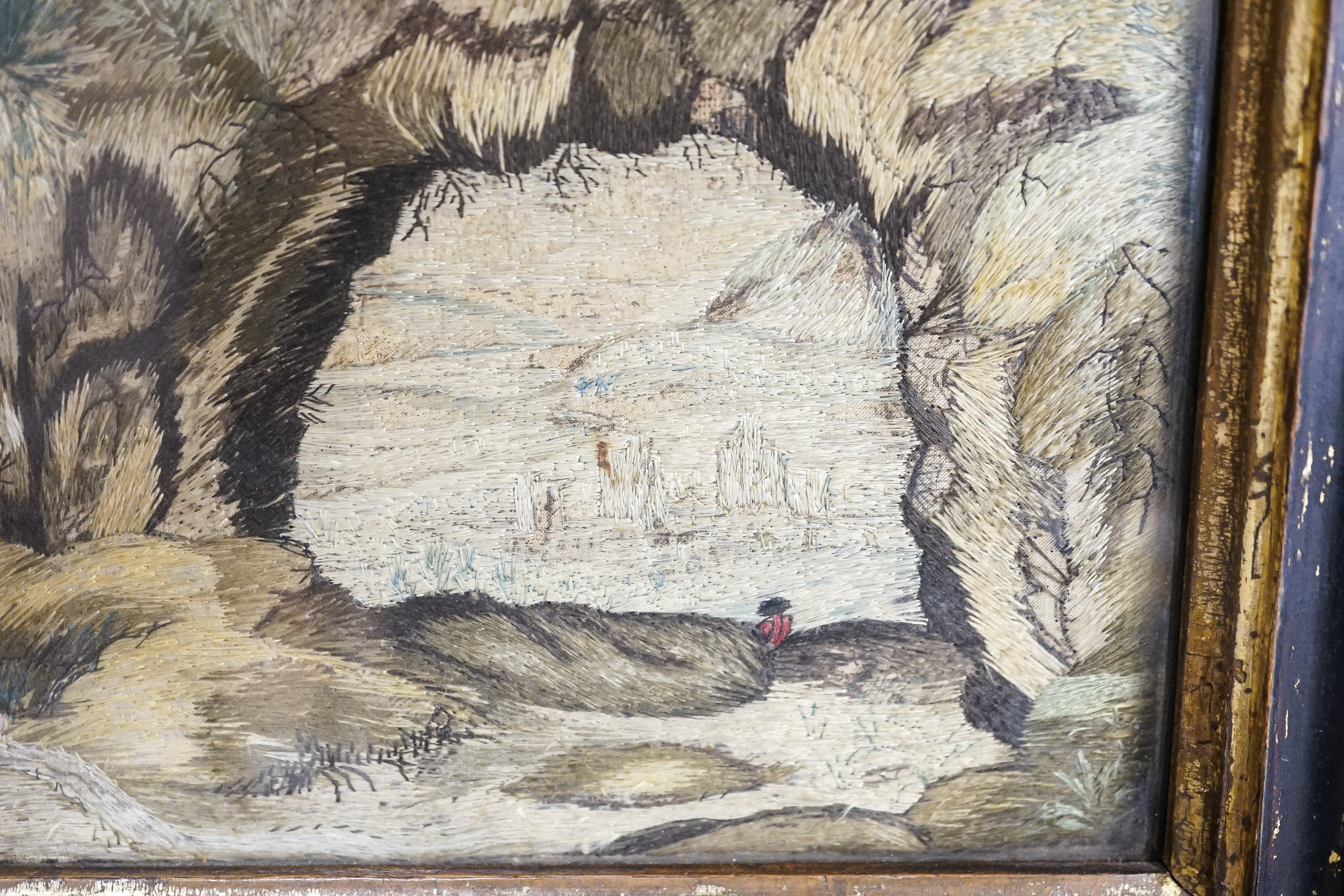 A pair of 18th century wool and silkwork pictures in ebonised frames, 26 cms high x 22 cms wide.